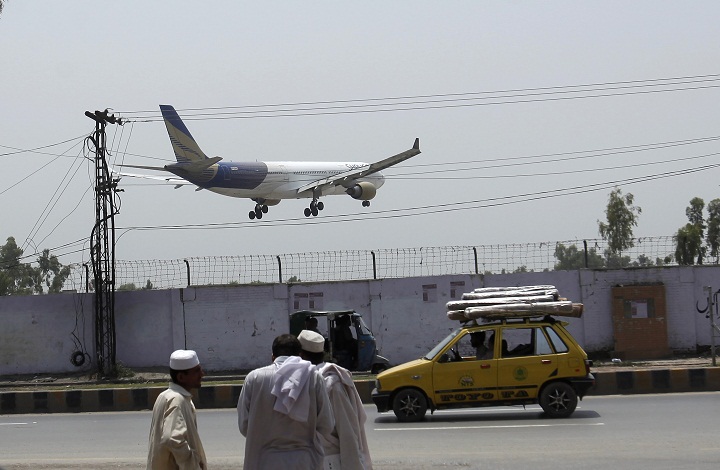 A Shaheen airplane is about to land at Bacha Khan airport in Peshaswar June 26, 2014. One woman was killed and three crew members were wounded as gunmen shot an Airbus 310 plane carrying 178 passengers from Saudi Arabia as it landed in the northern Pakistani city of Peshawar on Tuesday night. It was the third incident of violence to affect Pakistan's airports this month as international airlines review the safety of flying to a country with an increasingly violent Taliban insurgency. REUTERS/Fayaz Aziz (PAKISTANTRANSPORT - Tags: CIVIL UNREST POLITICS TRANSPORT) - RTR3VUUL